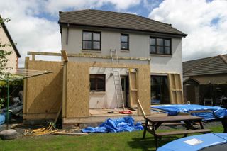 A home undergoing a renovation and seen from the outside