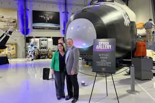 Lone Star Flight Museum president and CEO Doug Owens (right) and Allison McIntyre, chief of the Space Vehicle Mockup Facility at NASA's Johnson Space Center pose for a photo at the opening of the museum's new Space Gallery, Thurs., April, 13, 2023.