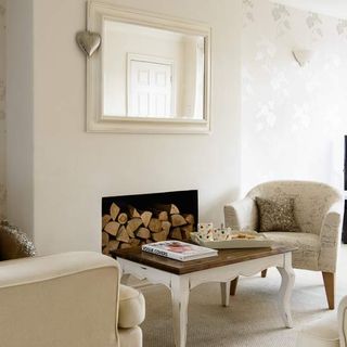room with white wall and fireplace