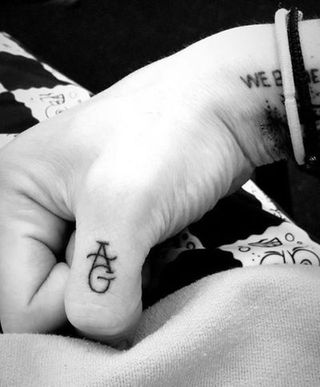 Finger, Wrist, Hand, Arm, Skin, Tattoo, Font, Black-and-white, Joint, Flesh,