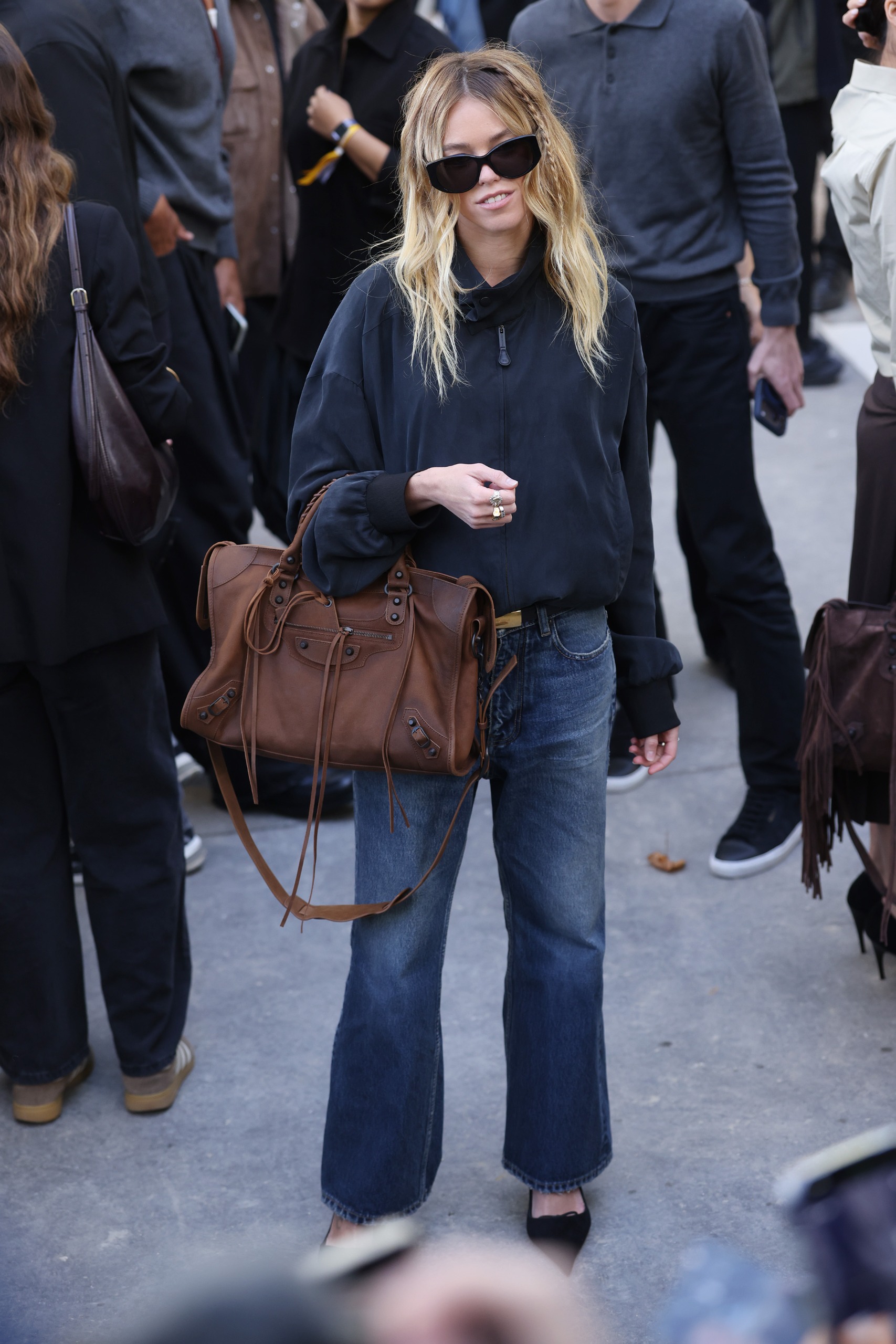 Milly Alcock's jeans outfit at the Balenciaga Spring/Summer 2027 show at Paris Fashion Week
