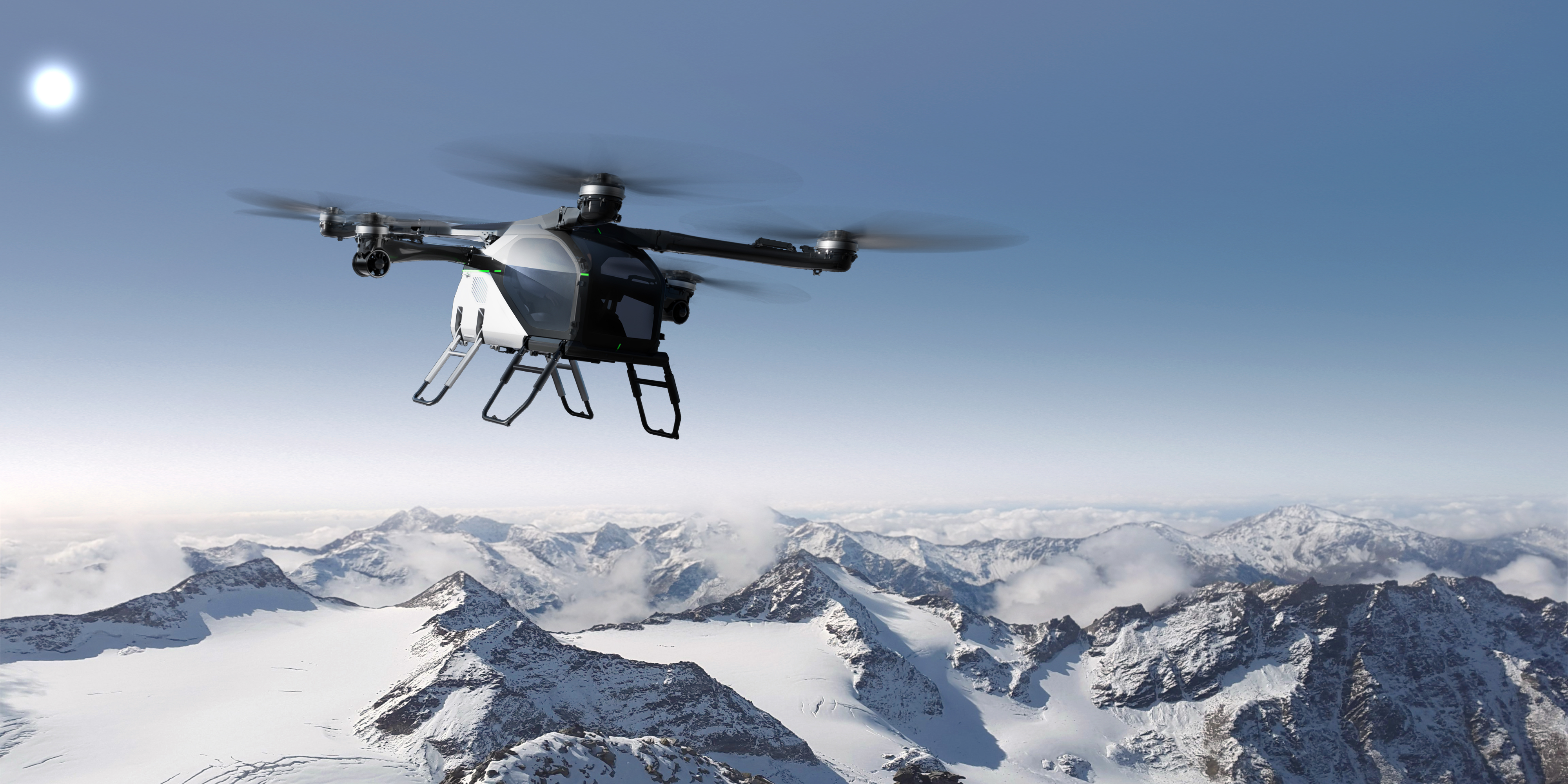 The copter from Xpeng's Land Aircraft Carrier shown with snowy mountains in the background.