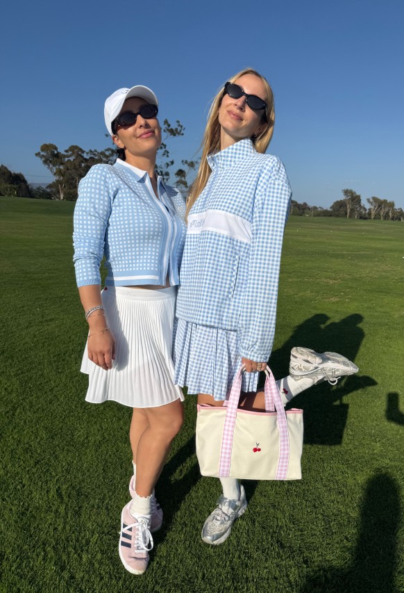 Erica Malbon and Harley Viera-Newton wear pieces from their Malbon x HVN golfwear collection on The Ritz Carlton Bacara golf course.