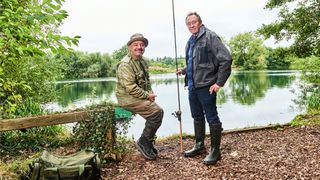 Bob Mortimer and Paul Whitehouse in fishing gear at Carp Lake in Shropshire for Gone Fishing
