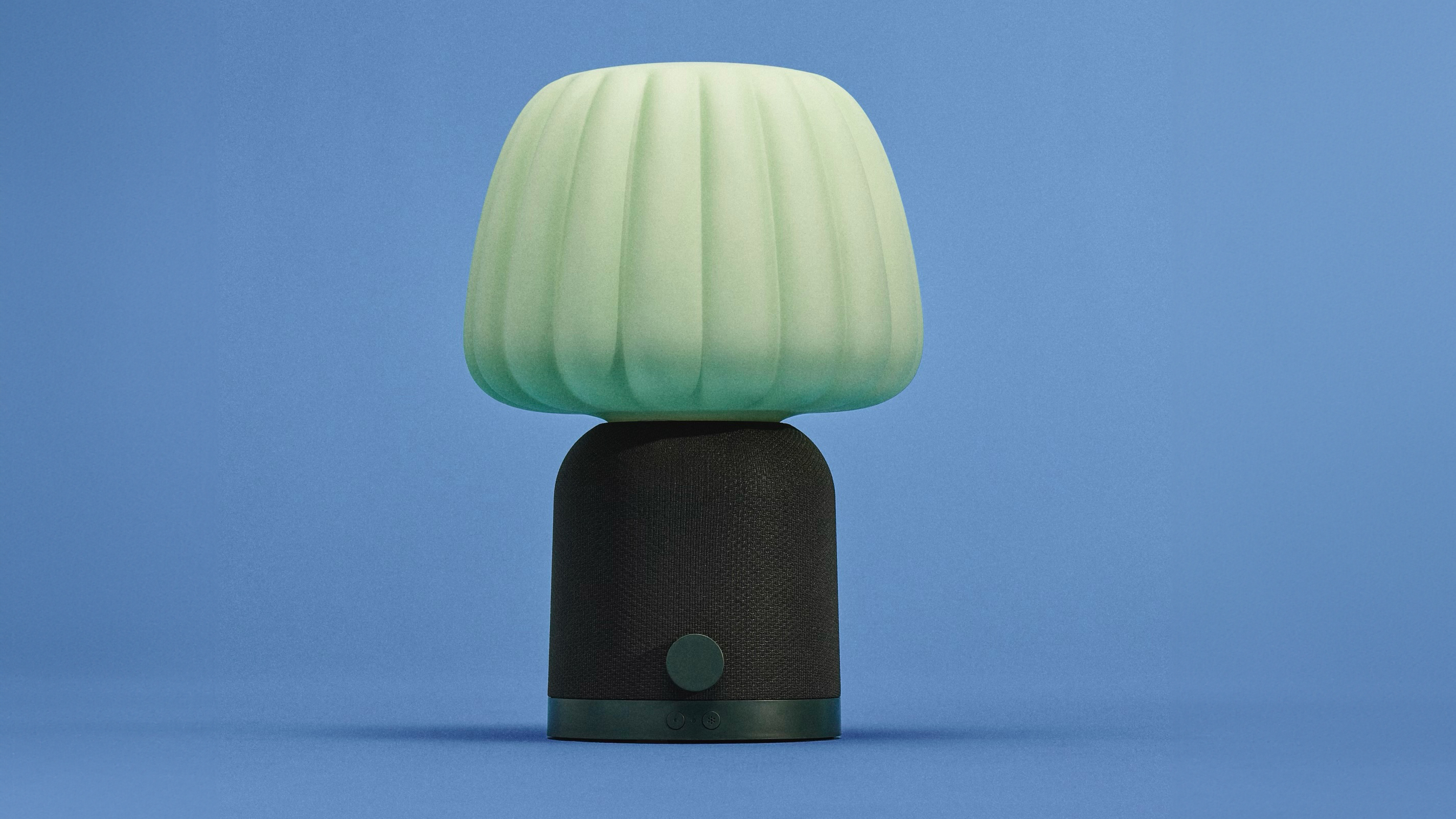 Two IKEA speaker lamps on a blue background