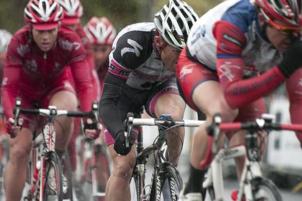 New Zealander Gordon McCauley (Hyster-Total Rush) shelters from the rain behind a rider in-front back in the chasing peloton.