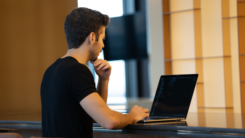 Man using laptop in office