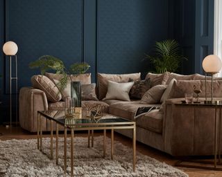 A navy living room corner idea by Sofology with floor lamps