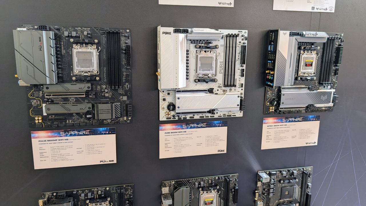 Sapphire motherboards mounted to a wall at Computex 2025