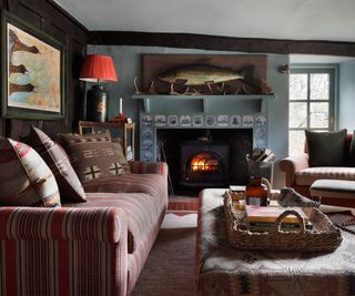 ralph lauren inspired cottage cozy living room with low ceiling beams and an eclectic vintage style