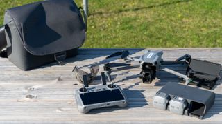 DJI Air 3S drone and travel bag on table