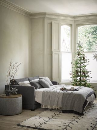 a sofa bed in a christmas living room