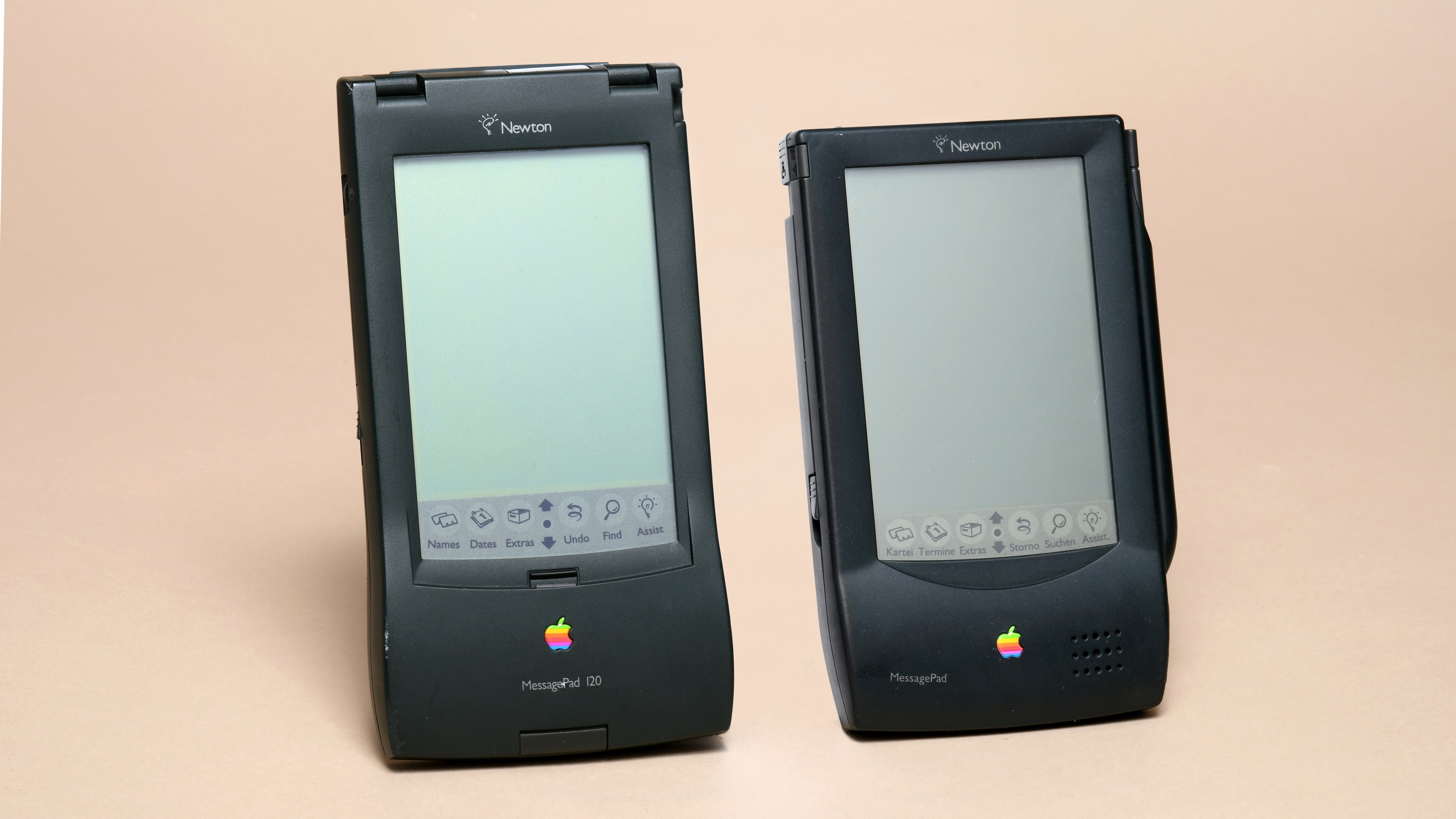 Two Apple Newton Messagepads on a beige background