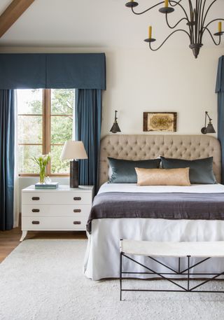 bedroom with blue curtains and pelmets