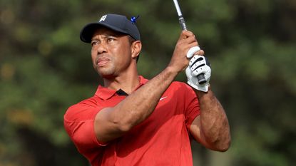 Tiger Woods watches his shot