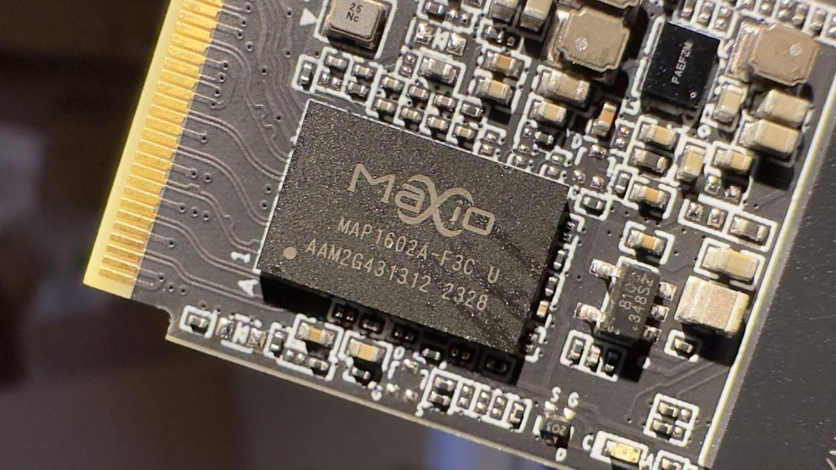 A close-up photo of a MaxioTech MAP1602A SSD controller chip, from a Team Group MP44 SSD