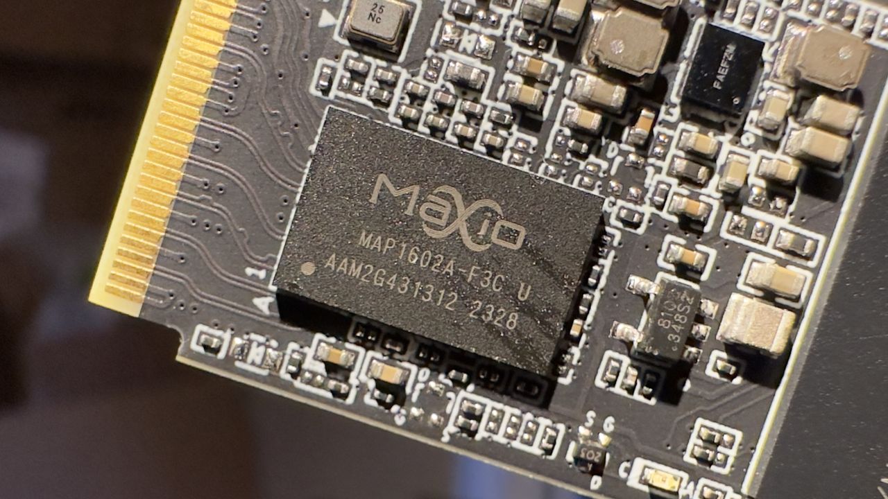 A close-up photo of a MaxioTech MAP1602A SSD controller chip, from a Team Group MP44 SSD