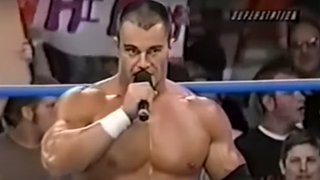 Lance Storm talking into a microphone on WCW TV.