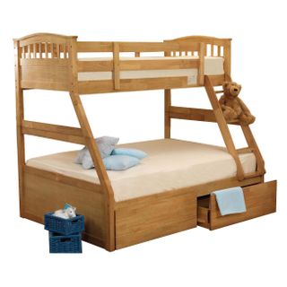 Bulky storage bunk bed with pillows and mattresses and teddy on ladder