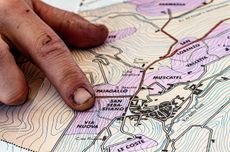 Prandi in Roddi Finger pointing at map of Barolo