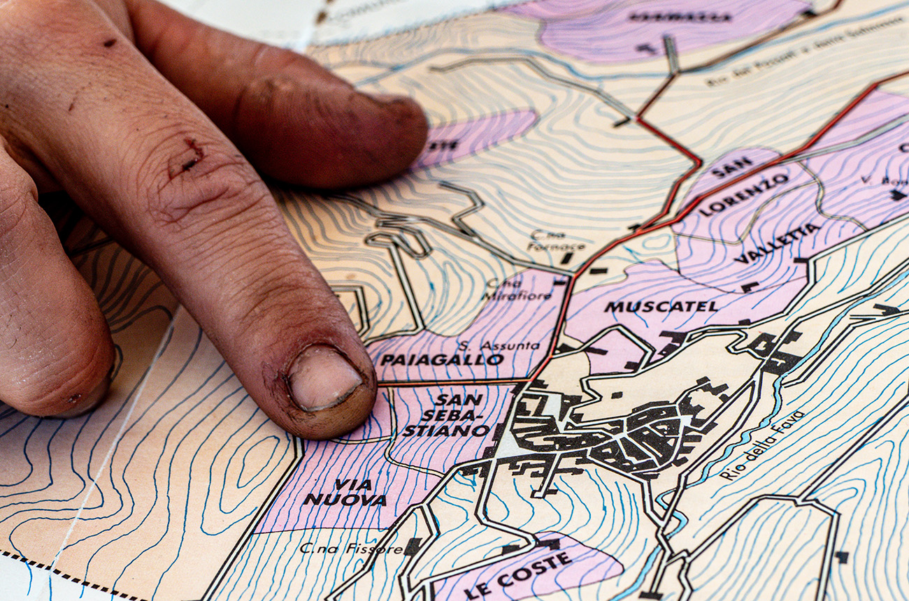 Prandi in Roddi Finger pointing at map of Barolo