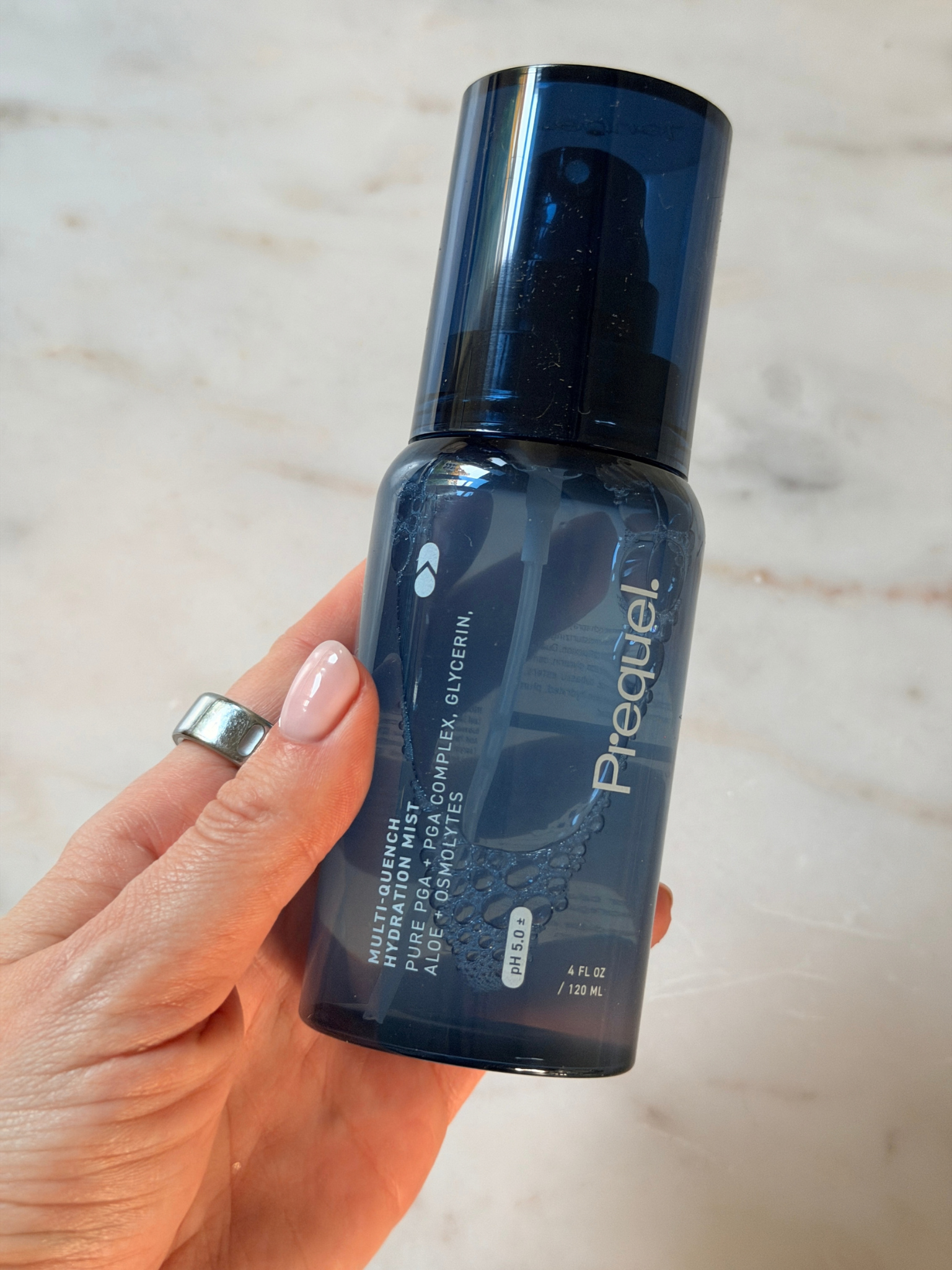 Freelance beauty editor Grace Day holding the Prequel toner