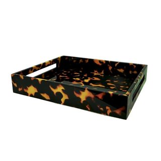 A tortoiseshell serving tray with handles is a functional tortoiseshell homeware piece.