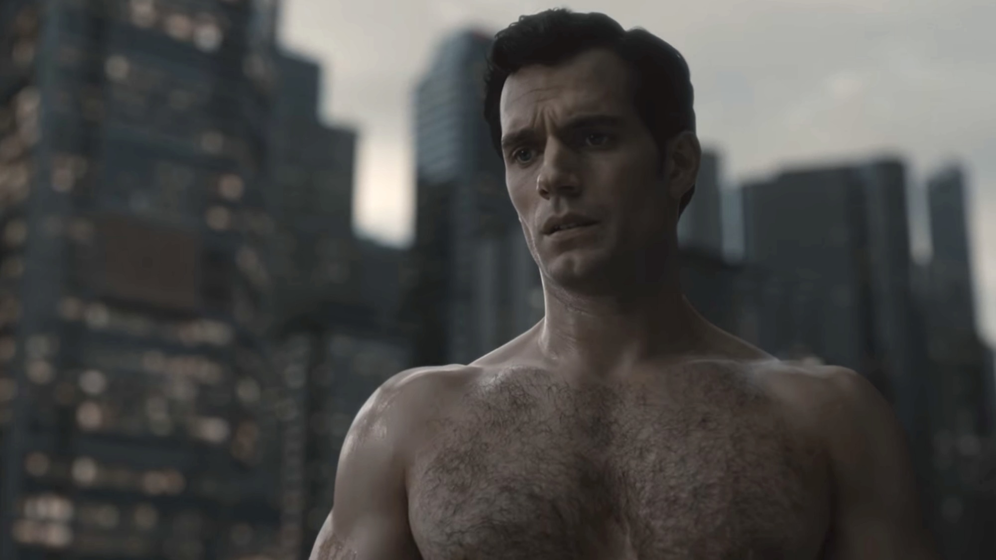 Henry Cavill shirtless in front of the Superman monument in Zack Snyder's Justice League. 