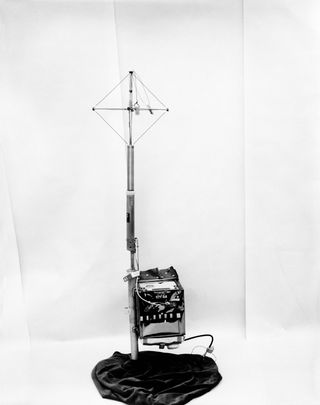 A photograph of the receiver-recorder portion of the surface electrical properties experiment. The small black box is attached to an antenna.