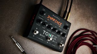An IK Multimedia Tonex pedal amp with guitar cables