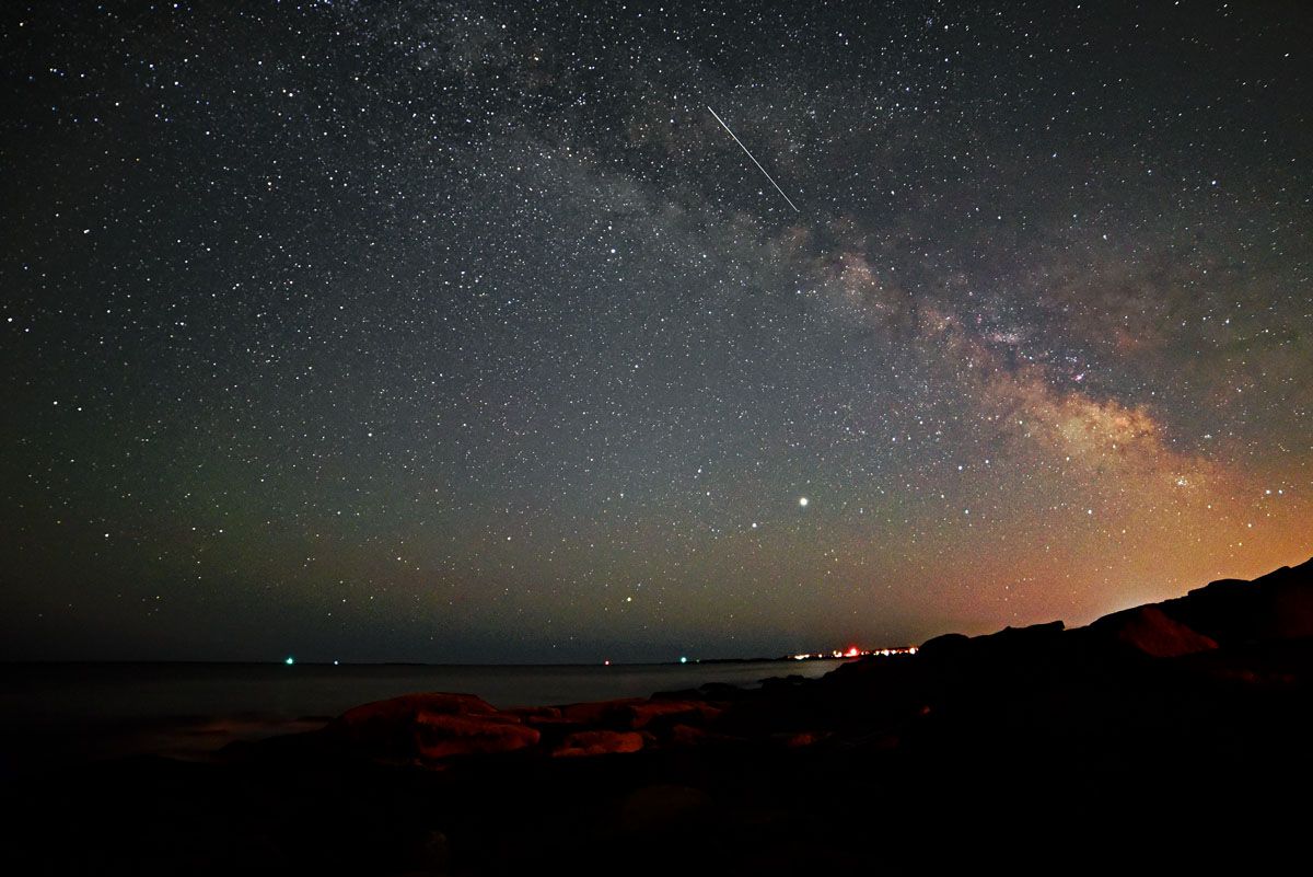 A meteor crosses in front of the Milky Way in this photo captured by Andrew March in Rockport, Massachusetts, on April 19, 2020.