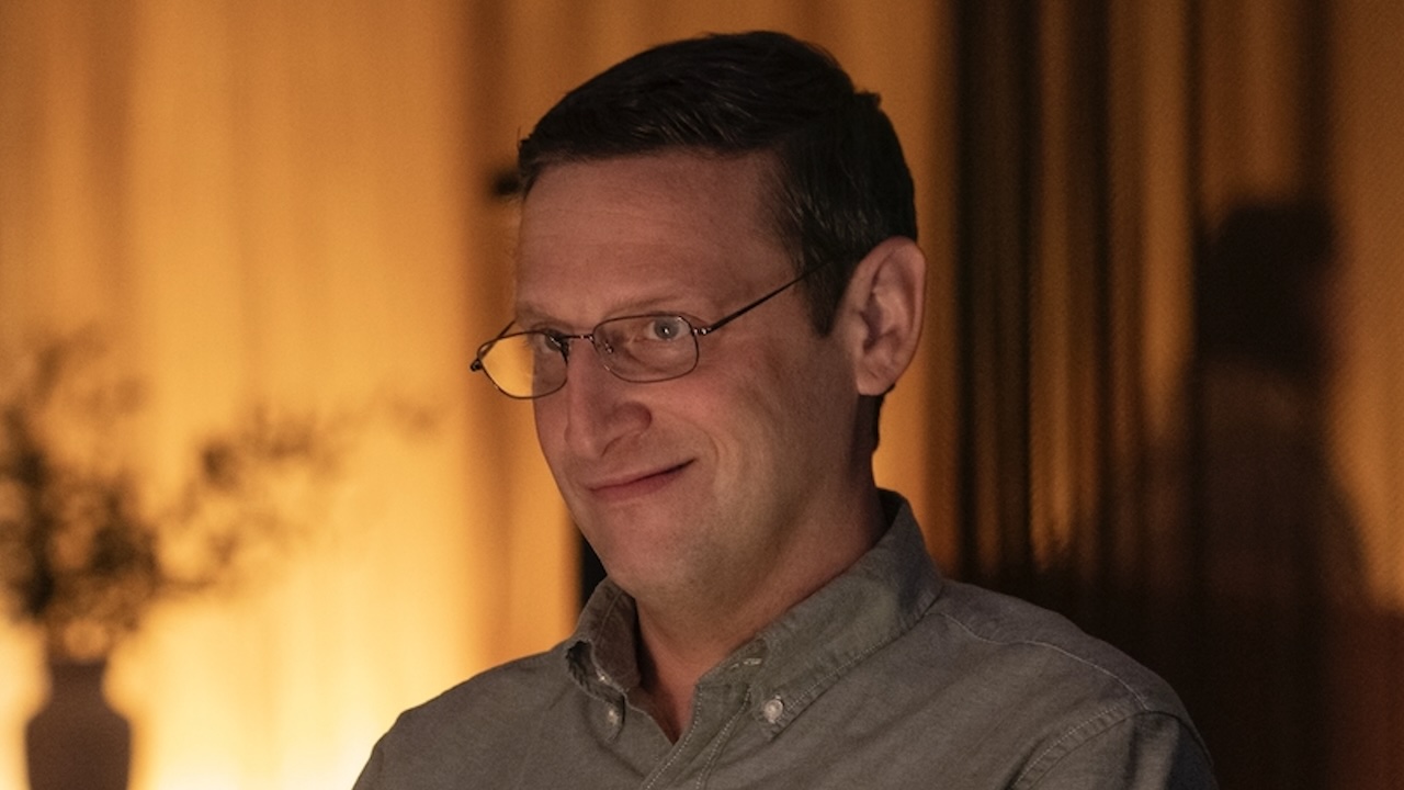 Ron smiling in karaoke bar in The Chair Company finale