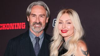 Mike Wolfe and Leticia Cline in black at The Reckoning Premiere red carpet.