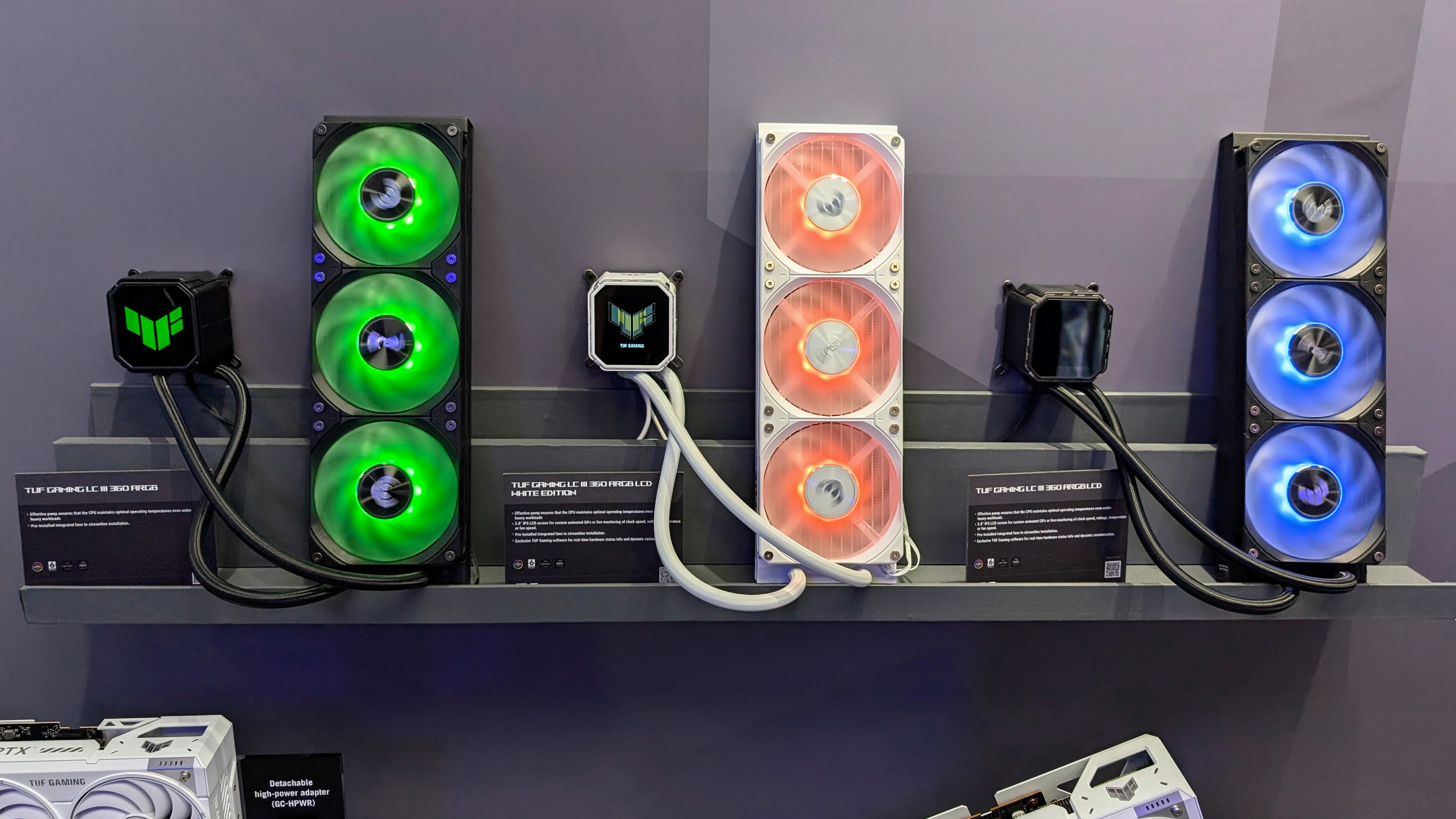 Asus TUF Gaming LCD III AIO coolers mounted to the wall at Computex 2025