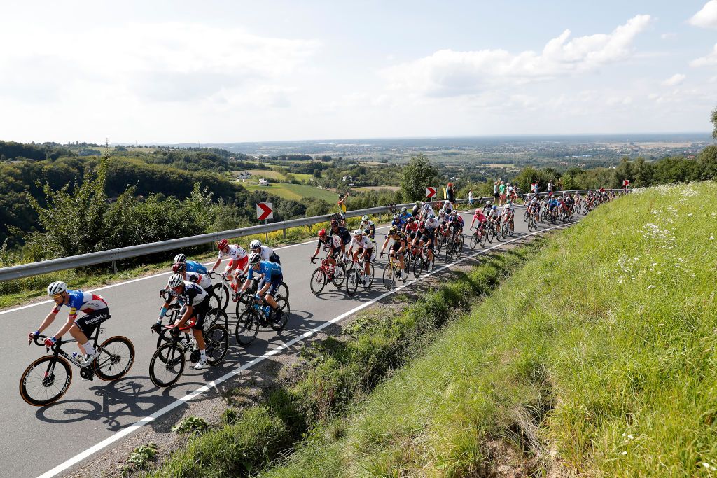 BUKOVINA RESORT POLAND AUGUST 12 LR Rmi Cavagna of France and Team Deceuninck QuickStep Dario Cataldo of Italy and Movistar Team Alessandro Covi of Italy and UAE Team Emirates Robert Power of Australia and Team Qhubeka Nexthash lead The Peloton during the 78th Tour de Pologne 2021 Stage 4 a 160km stage from Azoty Group Tarnw to Bukovina Resort 924m TourdePologne TDP2021 UCIWT on August 12 2021 in Bukovina Resort Poland Photo by Bas CzerwinskiGetty Images