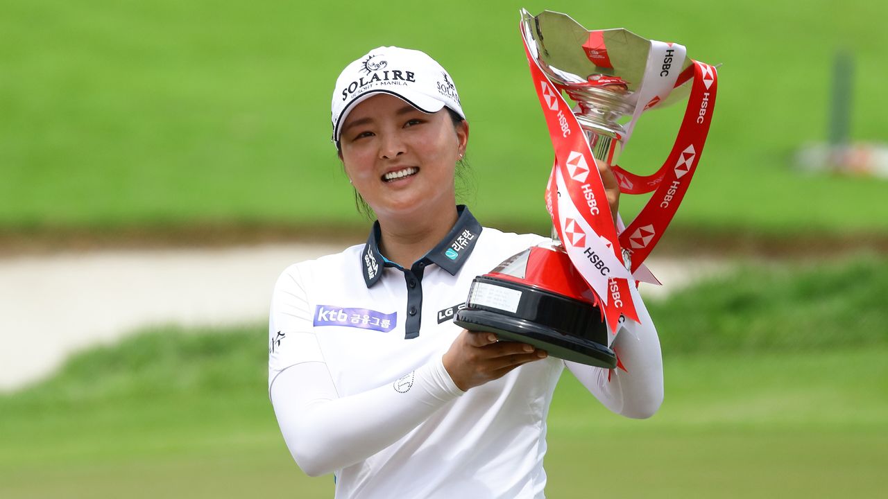 Jin Young Ko holds aloft the trophy after winning the 2022 HSBC Women&#039;s World Championship at Sentosa Golf Club