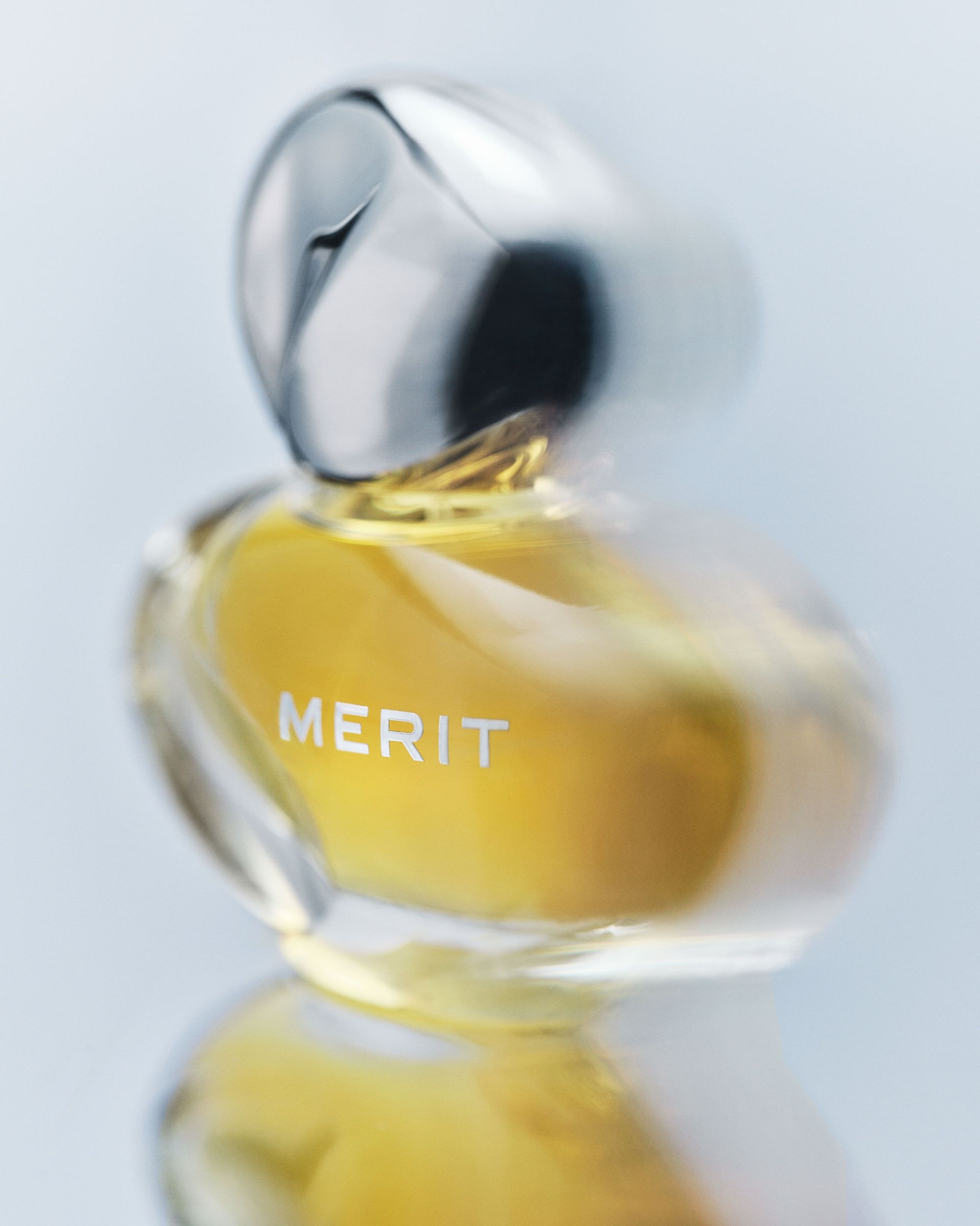 A bottle of Merit's New Wave L'Extrait de Parfum.