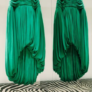 Green pleated fabric hanging down