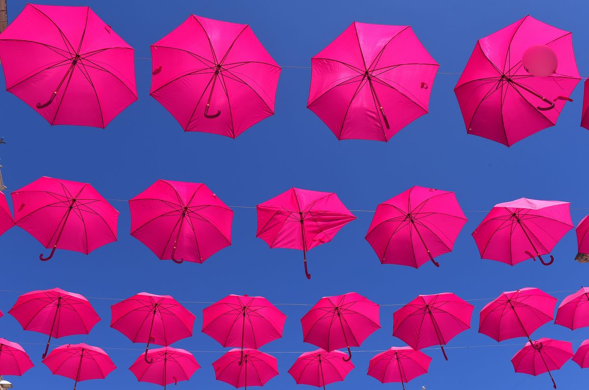 Pink umbrellas against the blue skies