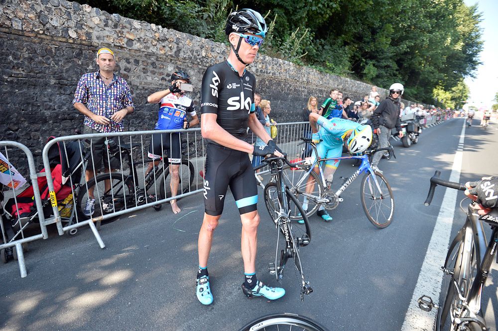 Chris Froome waits for a rear wheel.