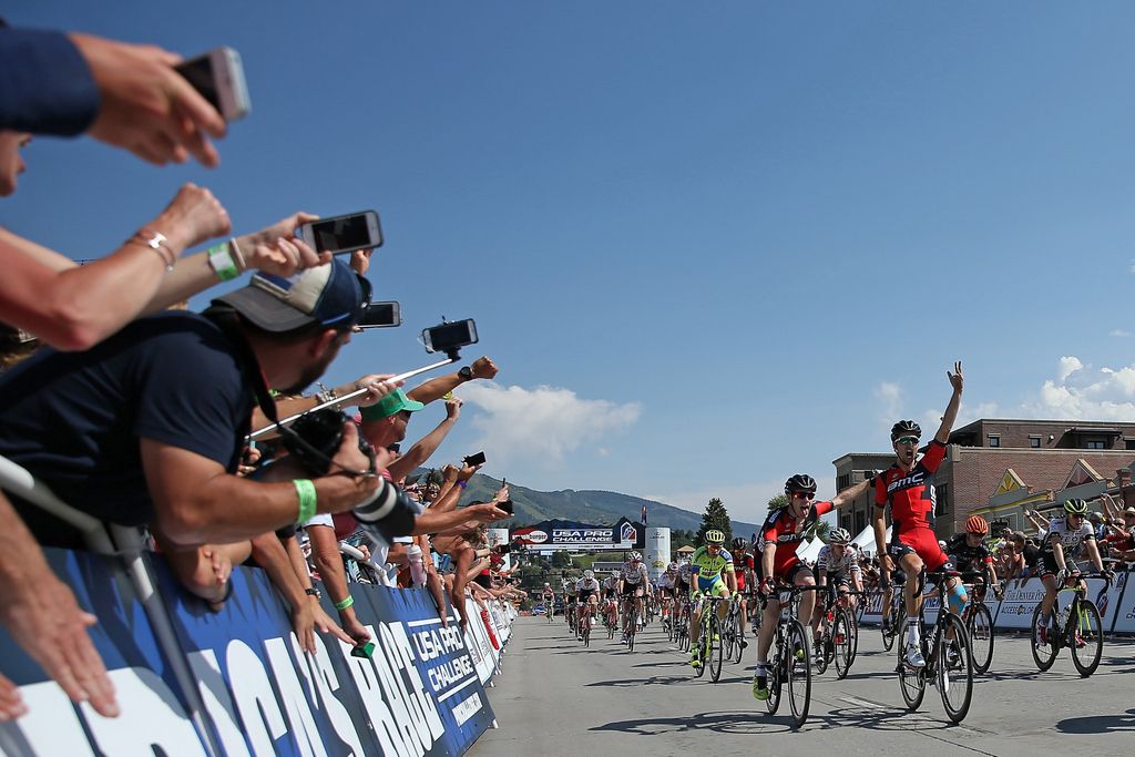 Brent Bookwalter helps Taylor Phinney (BMC) celebrate stage 1 victory