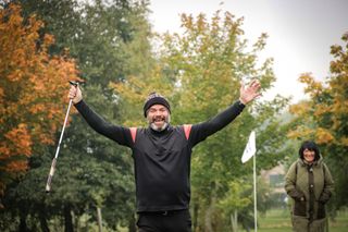 Golfer celebrates and smiles