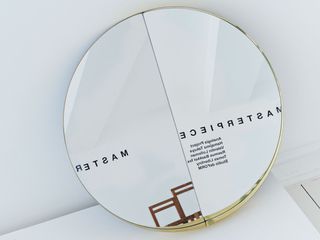 Circular mirror with words reflecting in it