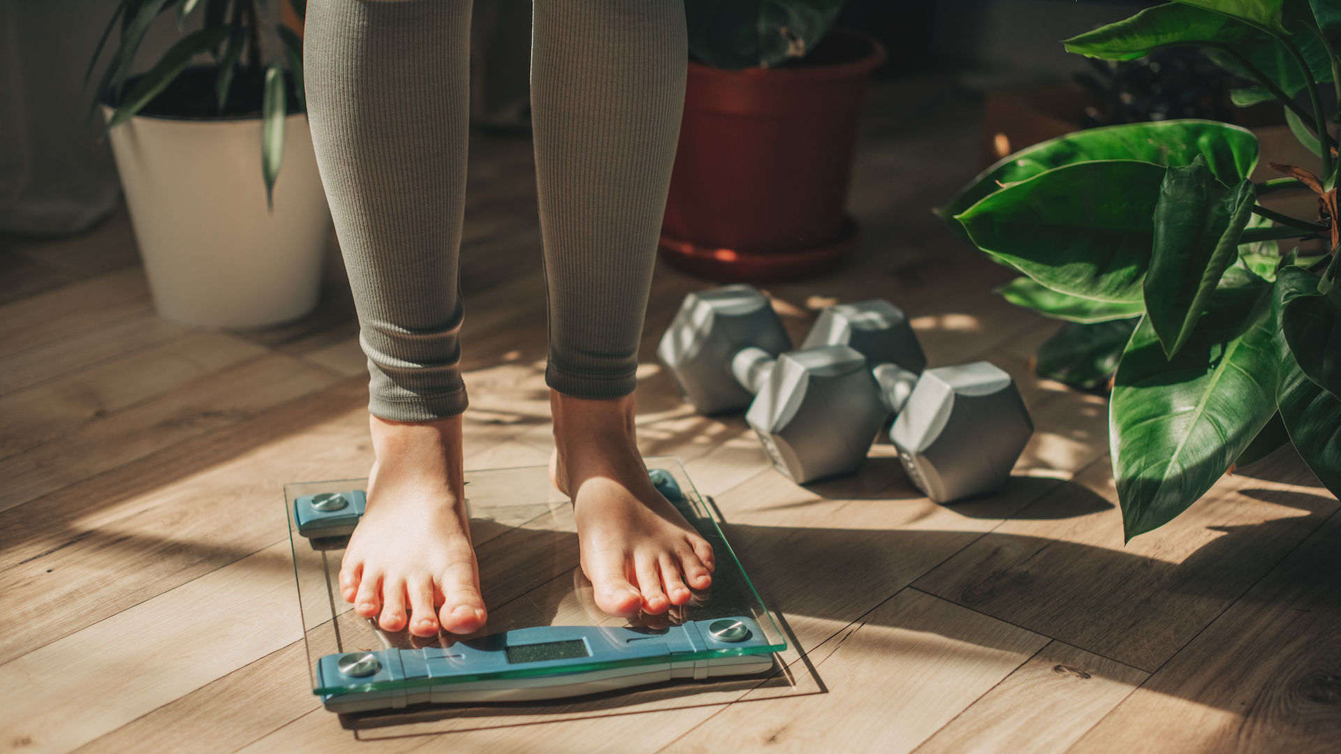 Woman standing on scales