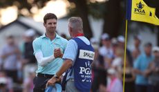 Alex Smalley shakes hands with his caddie