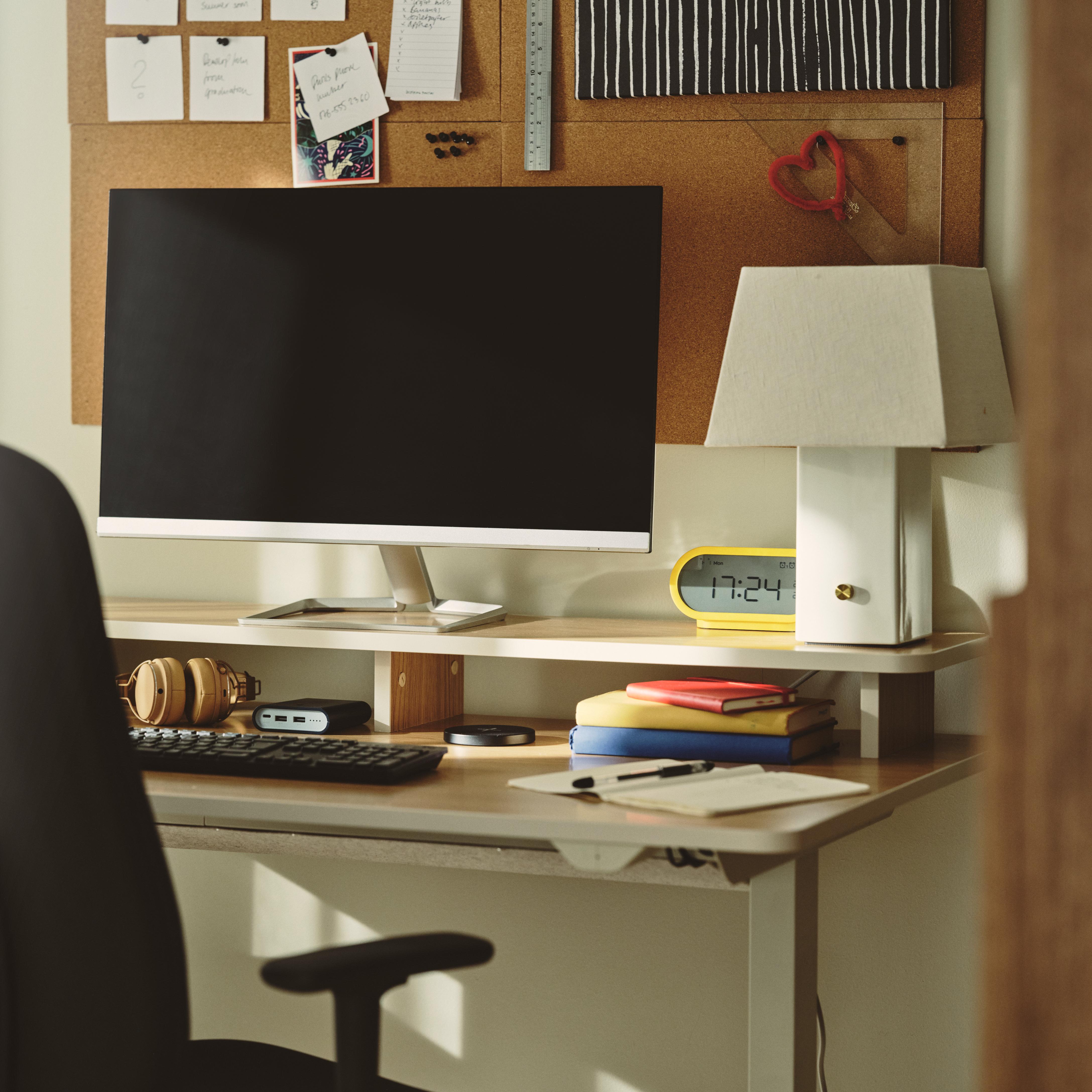 white linen lamp on a desk next to a screen