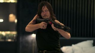 Norman Reedus' Daniel brandishing a shotgun in John Wick movie Ballerina