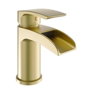 A brushed brass basin tap