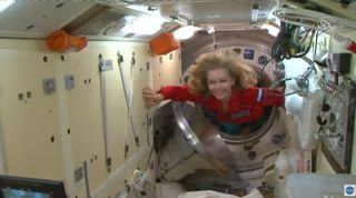 Russian actress Yulia Peresild enters the International Space Station after docking on Oct. 5, 2021.