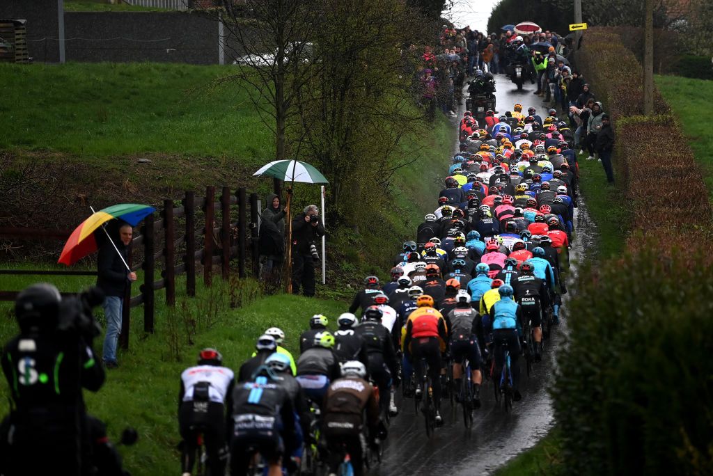 WEVELGEM BELGIUM MARCH 26 A general view of the peloton passing through Scherpenberg hill during the 85th GentWevelgem in Flanders Fields 2023 Mens Elite a 2609km one day race from Ypres to Wevelgem UCIWT on March 26 2023 in Wevelgem Belgium Photo by Tim de WaeleGetty Images